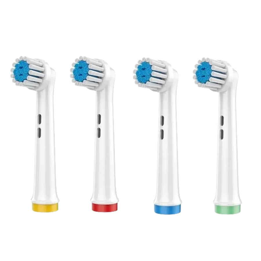 Quattro testine morbide compatibili Oral-B, setole bianche e ciuffo centrale blu, anelli giallo, rosso, blu e verde