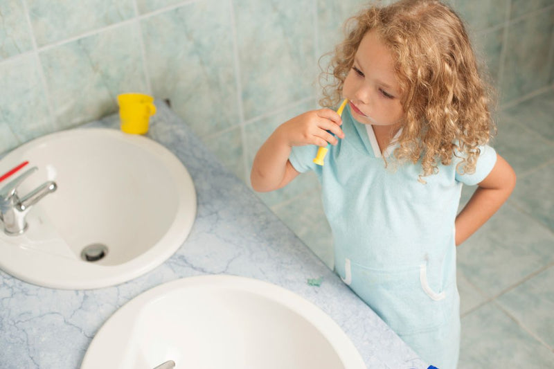 Toothpaste for children: what age, how much, and how to teach them
