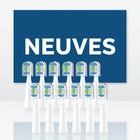 Brossettes de rechange ×10 ÉclatDent : Les brossettes de rechange devant une affiche avec le mot NEUVES en grandes lettres
