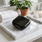 Aligner and retainer case — on a white marble tray in a bright bathroom