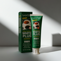 Dentifrice anti-taches café White Plus ÉclatDent, tube vert et boîte contre les taches de café et de thé