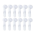 Twelve clear covers for round brush heads on a white background