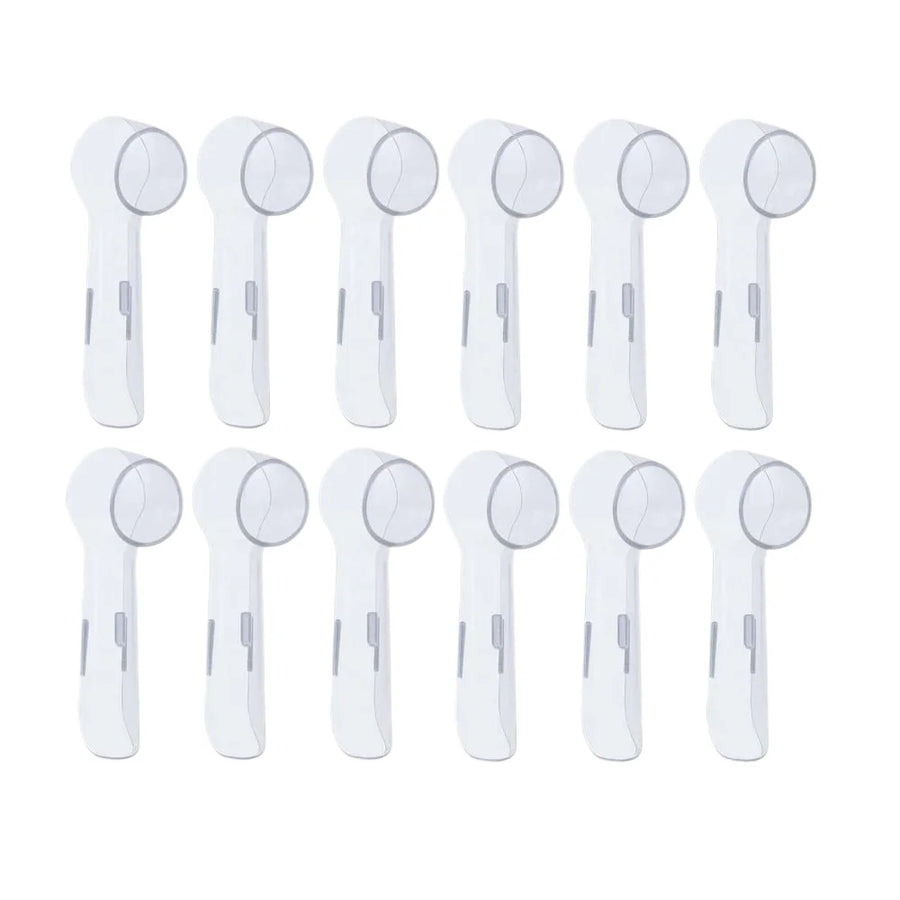 Twelve clear covers for round brush heads on a white background