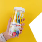 Clear tub with a white lid holding the coloured children’s toothbrushes