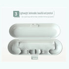 Open white travel case: holding clips for the handle and heads, ventilation holes