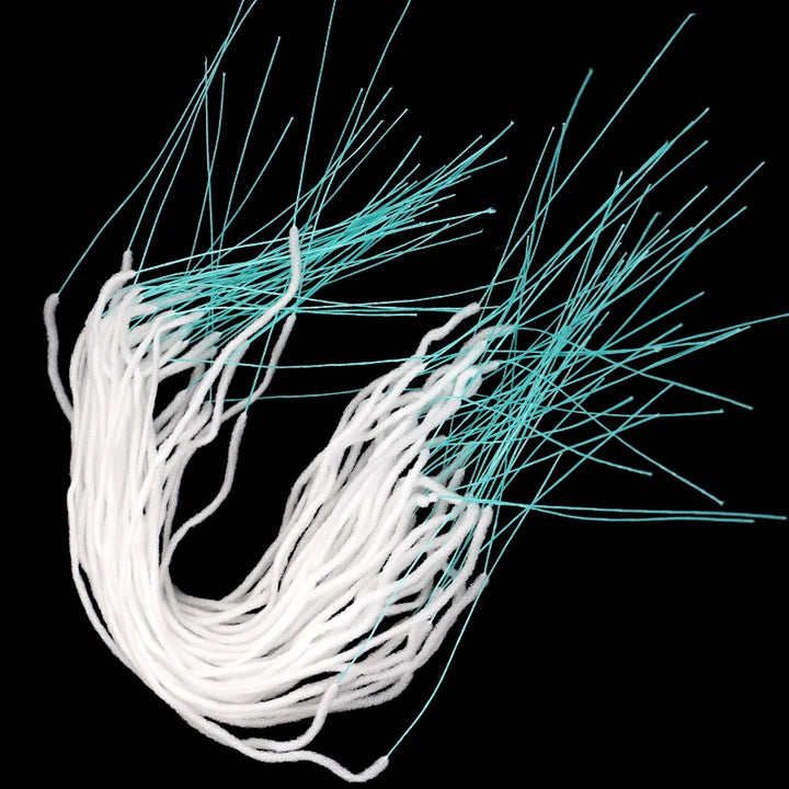 Bundle of pre-cut strands, white section in the middle and stiff turquoise ends
