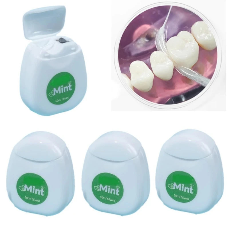 Distributeurs de fil dentaire blancs à étiquette verte « Mint », avec un modèle dentaire en médaillon
