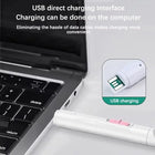 Miroir dentaire branché sur le port USB d’un ordinateur portable pour la recharge