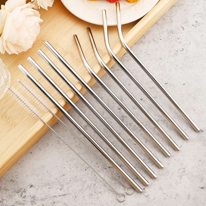 Eight silver stainless steel straws, four straight and four bent, with two cleaning brushes