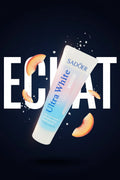 Dentifrice Pêche & Sel Marin ÉclatDent sur fond bleu nuit avec le mot ÉCLAT
